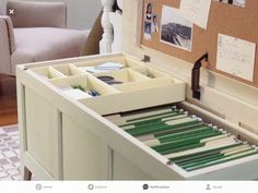 an open drawer with several files in it