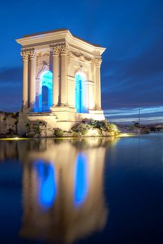 a large building sitting on top of a body of water