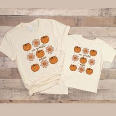 Introducing our latest mommy and me shirts! These cute and funny shirts feature witty definitions of "mama" and "mini" that are sure to make you and your little one smile. Perfect for matching family photos or everyday wear, these mommy and me shirts are made from high-quality materials and designed for maximum comfort. Choose from a variety of colors and sizes to fit your unique style. Our mommy and me shirts are perfect for any mom and daughter/son duo. These shirts are also great for baby showers, Mother's Day, thanksgiving or any special occasion. Whether you're running errands or having a family day out, these matching mommy and me shirts are sure to turn heads and make a statement. Please take a moment to read the details about these ,mama and me shirt, mom and son shirt,new mom shir Mom And Me Shirts, Mom Of Boys Shirt, Daughter Christmas, Mommy And Me Shirt, Mom Life Shirt, Matching Tees, Great Gifts For Mom, Pumpkin Shirt, Adulting Shirts