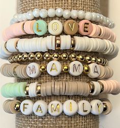 "Custom Word Heishi Stack Bracelets / Pastel Beaded Heishi Bracelets \"MAMA...LOVE...FAMILY\" Fun! Trendy! So Pretty! *Listing includes one bracelet *Option to choose 1 or more bracelets *Let me know your choice of 7 bracelets (A,B,C,D,E,F,Gold) in the Note to Seller box at checkout. *Customize by choosing Words to replace \"MaMa\", \"Family\", \"Love\" in the personalization box. If no words chosen you will receive the default words shown. *Placed in a burlap drawstring bag (or a gift box Mother's Day Jewelry With Heishi And Letter Beads, Adjustable Pastel Beaded Bracelets As Gift, Mother's Day Jewelry With Letter And Heishi Beads, Multicolor Heart Beads Bracelets For Mother's Day, Birthday Bracelets With Round Heishi Beads, Adjustable Heishi Beaded Bracelets For Birthday, Birthday Bracelet With Heishi Beads, Adjustable Heishi Beads Bracelet For Birthday, Heishi Beads Bracelets For Birthday