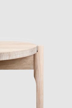 a close up of a wooden table on a white background with an empty space in the middle