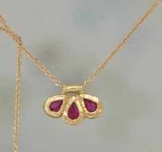 "18k Gold Ruby Pendant, Three Teardrop Ruby Stones, Flower Gold Pendant, Gold Ruby Necklace, Unique Handmade Gold Pendant, 18k Charm Necklace This special jewelry is made of 18k solid gold. Three beautiful Red Ruby teardrops are set in a unique gentle hammered setting. The pendant looks like a small flower. ** 18k solid gold pendant ** Three red ruby teardrop stones ** 14k gold Rolo necklace 1.1 m\"m My shop: https://www.etsy.com/shop/malkaravinajewelry?ref=seller-platform-mcnav Necklace in my s Cute Gold Necklace Unique, Pendant With Stone, Gold Ruby Necklace, Fantasy Earrings, The Bling Ring, Engagement Earrings, Gold Pendant Jewelry, Vintage Jewelry Necklace, Snake Jewelry