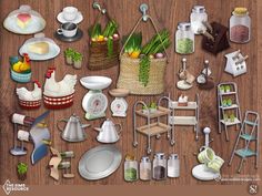 a wooden table topped with lots of different types of kitchen utensils and dishes