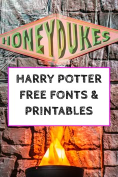 harry potter free font and printables on display in front of a brick wall