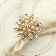 a white plate topped with a napkin covered in pearls