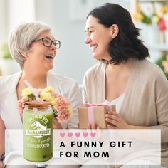 two women sitting next to each other with gifts in front of them and the words, having your favorite child a funny gift for mom