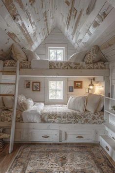 an attic bedroom with bunk beds and rugs