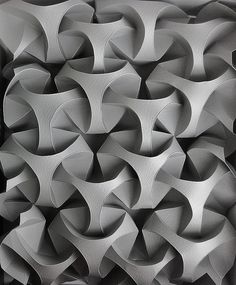 an abstract sculpture is shown in black and white, as well as the background for this image