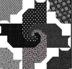 a black and white quilt with different patterns