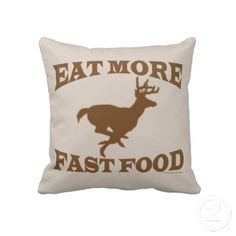 a pillow that says eat more fast food with a deer on the front and brown lettering