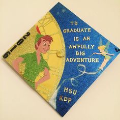 a blue and yellow graduation cap with tinkerbells on the front that says, to graduate is an awfully big adventure