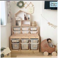 there is a shelf with many containers on it and a teddy bear next to it