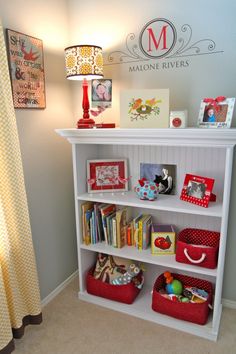 an image of a white book shelf with red baskets on it and the word, mom's day written in large letters