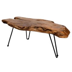 a wooden table with hairpin legs and a large piece of wood on the top