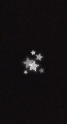 four white stars are glowing in the dark