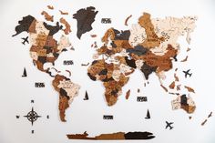 the world map is made out of wood and has different types of maps on it