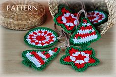 four crocheted ornaments sitting on top of a wooden table next to a basket