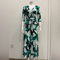 Dress , Maxi , Floral , Stretch , 3/4 Sleeve , V Neck With Front Tie. Available Sizes : S-M-L-Xl Green 3/4 Length Dress For Spring, Green Printed Half-sleeve Dress, Green Printed Half Sleeve Dress, Chic Green Dresses With 3/4 Sleeves, Chic Green Dress With 3/4 Sleeves, Green 3/4 Sleeve Maxi Dress For Vacation, Green 3/4 Sleeve Dresses For Brunch, Aztec Print Maxi Dress, Summertime Dresses