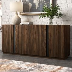 the sideboard is made out of wood and has two doors on one side, with an