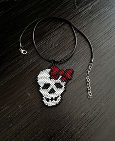 Let me me present you human sugar skull beadwork art pendant necklace jewelry. It is happy Halloween skeleton art beadwork pendant necklace. The length of the cord is 17,3 (+1,6) inches. Pendant high is 2.4 inches, pendant width is 2 inches. You can buy earrings from this link in the kit for this necklace https://www.etsy.com/listing/624693439/sugar-skull-helloween-earrings-fesival?ref=shop_home_active_4&pro=1&frs=1 This necklace can be a great gift for your family and friends for the Halloween holiday. Also you can buy it for yourself on Halloween as an addition to your costume or separately as decorations for creating a festive mood. Putting on carnival costumes for this holiday originates in the tradition of Celtic peoples to dress in animal skins on Samhain to protect themselves from e Skull Print Necklace For Halloween Gift, Handmade Beaded Necklaces For Halloween Gift, Day Of The Dead Beaded Jewelry Gift, Sugar Skull Costume, Tassel Necklace Boho, Beads Patterns, Boho Statement Necklace, Beaded Spiders, Sugar Skull Art