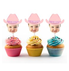 three cupcakes with hats on top of them