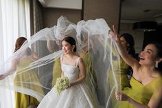 the bride and her bridal party are getting ready to walk down the aisle at their wedding