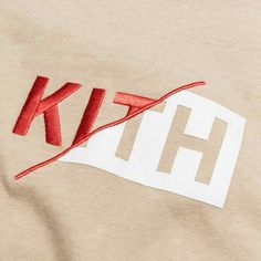 the letters are cut out and placed on top of a t - shirt that says kit