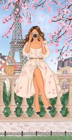 a woman is sitting on a ledge in front of the eiffel tower with her hands to her face