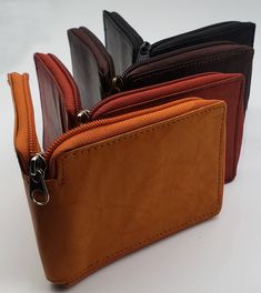 Genuine Cowhide Leather Dimensions (LxW): 4 1/4 in x 3 1/4 in (closed) 9 Credit card slots with 2 additional side slots / 1 ID window Divided bill compartment (Two separate compartments) Full zip-around closure for the wallet We urge customers to please keep track of your delivery day, so you know when it's being delivered. Package Theft (this includes items that show delivered but not received by customer) is not covered by our shop. We sincerely apologize but we will not replace at our expense Leather Bifold Wallet With Zipper Pouch, Brown Bifold Wallet With Zipper Pocket, Brown Bifold Coin Purse With Zipper, Leather Bifold Coin Purse With Zipper, Card Id, Front Bottoms, Zipper Wallet, Bifold Wallet, Wallet Men