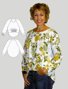 a woman standing next to a white shirt with yellow flowers on it and her hands in her pockets