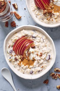 two bowls of oatmeal with apples and pecans