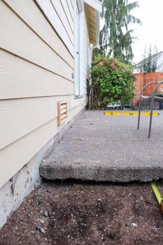 a cement step with a yellow tape around it