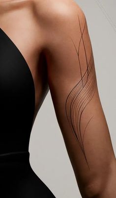 the back of a woman's arm with lines on it