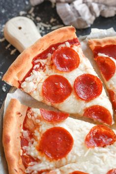 a pepperoni pizza cut into four slices