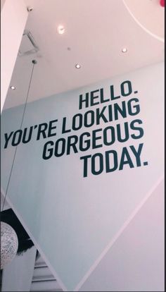 a sign that says hello you're looking gorgeous today