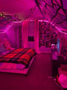 a bed room with a neatly made bed and purple lighting