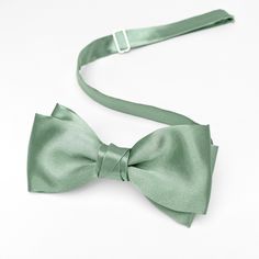 a close up of a bow tie on a white surface