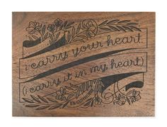 a wooden plaque with the words, i carry your heart and it's in my heart