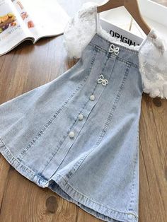 Grow with the flow with this unique toddler's denim dress ideal for warm weather! The adorable button-down design and pearl detailing add a little extra flair! Sensible for casual and dressy occasions. Perfect for spring, summer, birthday parties, and year-round play. Includes dress in sizes 3T-7Y. Shop Mia Belle Girls Cute Short Sleeve Denim Dress, White Denim Dress For Summer, White Denim Summer Dress, Cute Denim Dress With Pockets For Summer, Cute Summer Denim Dress With Pockets, Casual White Denim Dress, Cute Blue Denim Summer Dress, Cute Denim Blue Summer Dress, Spring A-line Denim Dress With Pockets