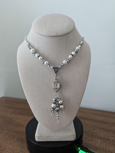 This necklace has a vintage (non-working) Elgin watch marked 10K RGP. The watch is strung with pearl, silver, hematite and crystal beads which also dangle from the watch. The silver tone chain is dotted with faux pearls to complete the look. Given the age of the components, there will be scratches and scuffs on the watches and crystals, but I think that just adds to the vintage look...a real stunner! This necklace is 17" long. The pendent portion is 3.5". These necklaces make a statement and are perfect for anyone who loves vintage or steampunk style. Wear one on its own for a simple and elegant look, or pair with one of my bracelets and earrings to create a bold and eye catching outfit. Add a touch of time-worn charm to your jewelry collection! **I welcome custom orders! If you have somet Elgin Watch, Sundance Style, Steampunk Style, Crystal Wedding, Steampunk Fashion, Upcycled Vintage, Style Necklace, Silver Pearls, Looks Vintage