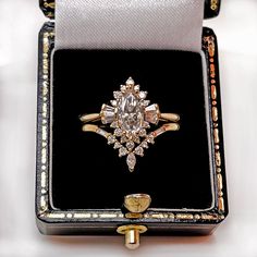 an open box with a ring in it