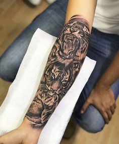 a person with a tiger tattoo on their arm