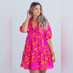 Our New Hot Pink And Orange Floral Dress Is Going To Having You Dreaming Of Summer Days! The Gorgeous Color, Flattering V-Neck Design And Tiered Style Make This Dress Cute On Everyone. Paired With The Flirty Puff Sleeves, This Dress Is Sure To Impress This Spring And Summer! Size Small Vibrant Floral Print V-neck Mini Dress, Vibrant Pink Floral Print Midi Dress, Vibrant Pink Midi Dress With Floral Print, Spring Pink Split Neck Dress, Vibrant V-neck Mini Dress With Floral Print, Pink V-neck Summer Midi Dress, Pink V-neck Mini Dress For Day Out, Vibrant Pink Mini Dress For The Beach, Vibrant Pink Mini Dress For Beach