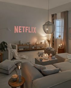 a living room filled with furniture and candles