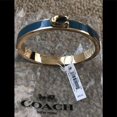 Brand New Coach Bangle With Tags Gold And Indigo Hinged Opening Designer Blue Bracelet Jewelry, Chic Coach Bangle Bracelet, Chic Blue Jewelry For Formal Occasions, Chic Coach Bracelet Jewelry, Chic Coach Bracelet, Coach Bangle, Coach Fashion, Coach Jewelry, Dream Jewelry