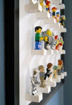 legos are lined up on the wall to display them