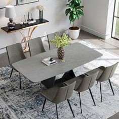 a dining room table with chairs around it