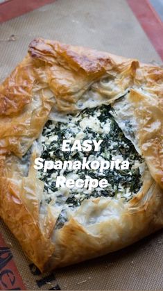 a piece of bread with spinach and cheese in it sitting on a mat next to the words easy spanacobia recipe