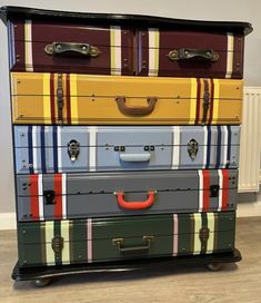 four suitcases stacked on top of each other