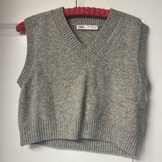 Grey Zara Sweater Vest, So Cute With Baggy Jeans And A White Tee Underneath. Never Worn Casual Cropped Sweater Vest For Winter, Zara Casual Sweater Vest For Fall, Zara Casual Winter Vest, Zara Sleeveless Sweater For Winter, Zara V-neck Winter Tops, Zara Casual Vest For Fall, Zara Sleeveless Winter Sweater, Zara Sweater, White Tee